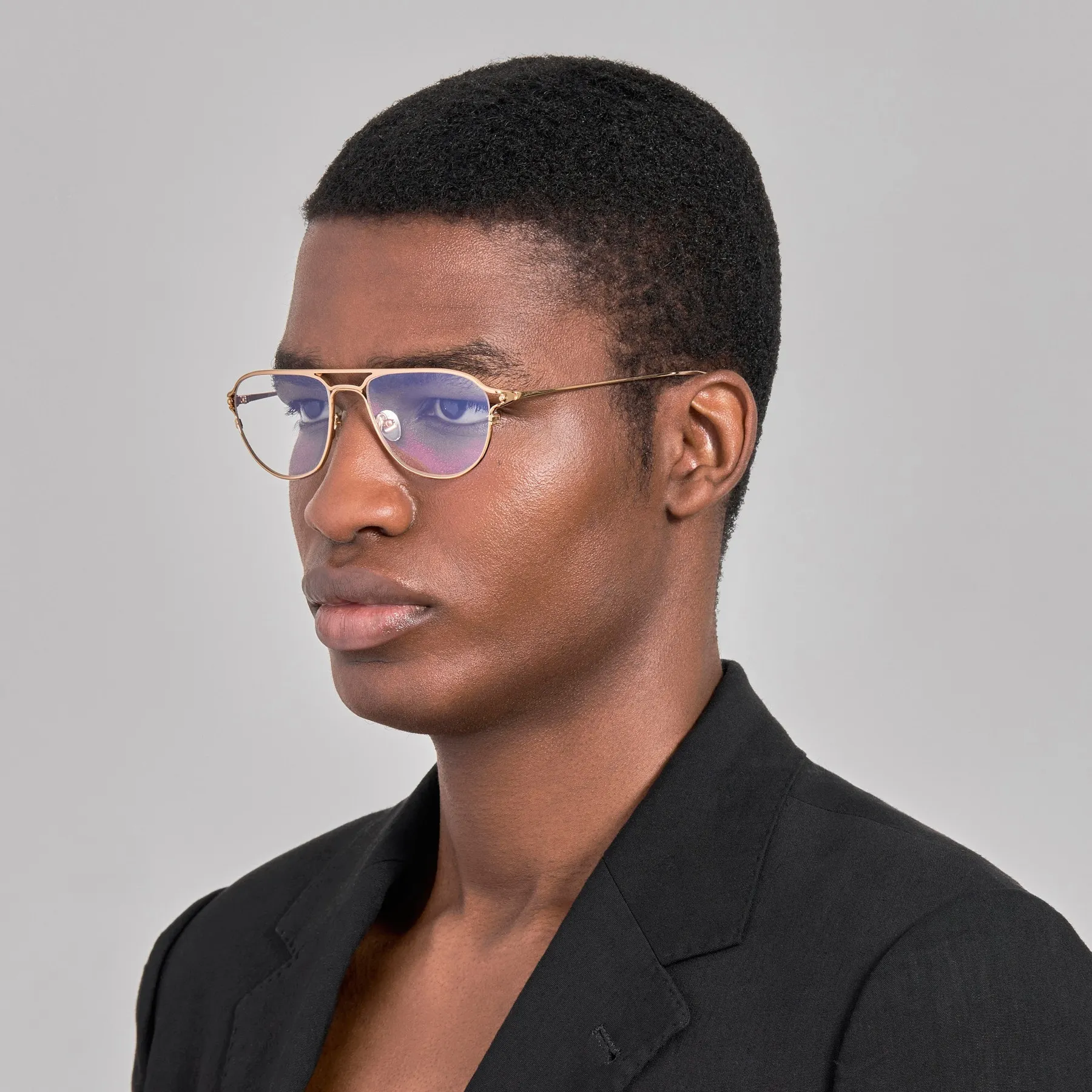 Model wearing Jacquemus Acapulco optical glasses in Light Gold