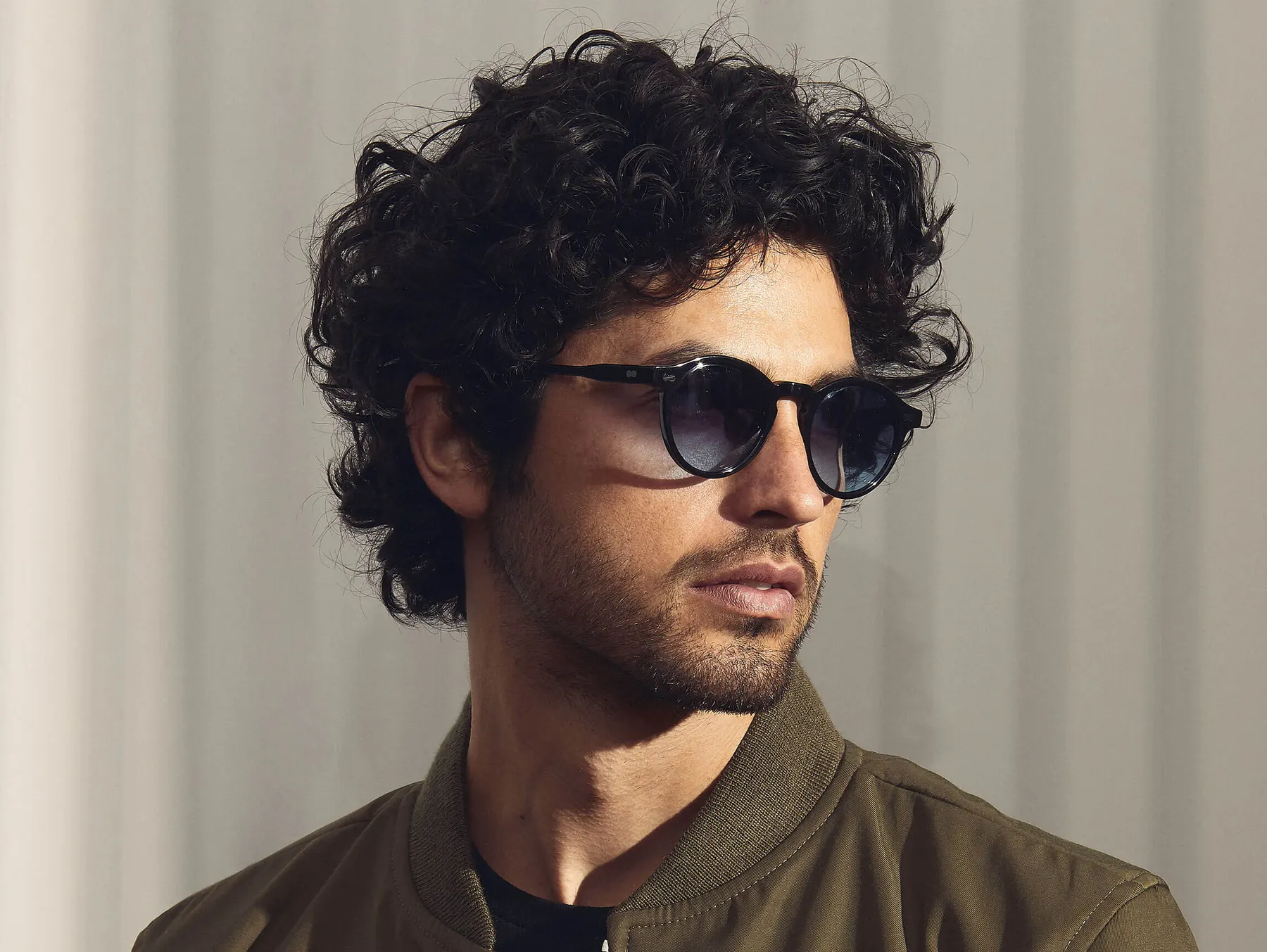 Moscot Miltzen Sun sunglasses, colour Black, Denim Blue lenses, worn on a model