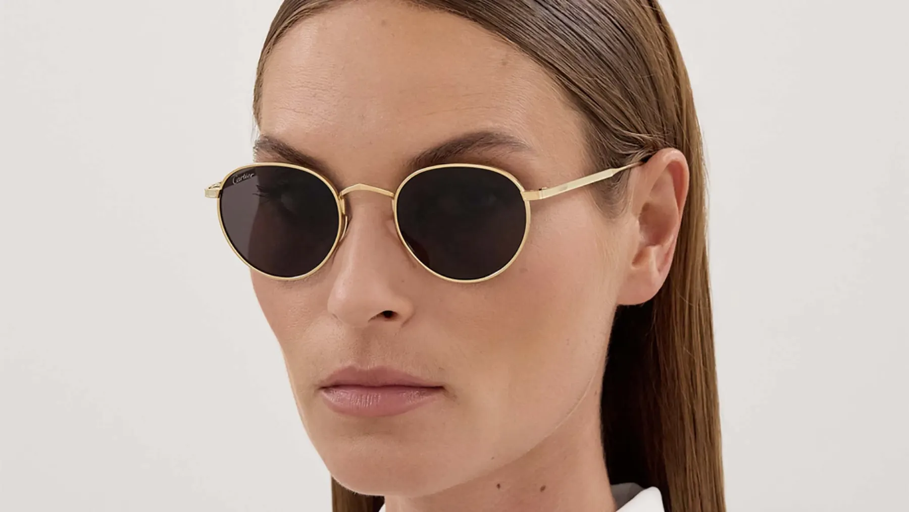 Cartier Signature C de Cartier CT0626S sunglasses, colour Gold/Grey, worn on a model